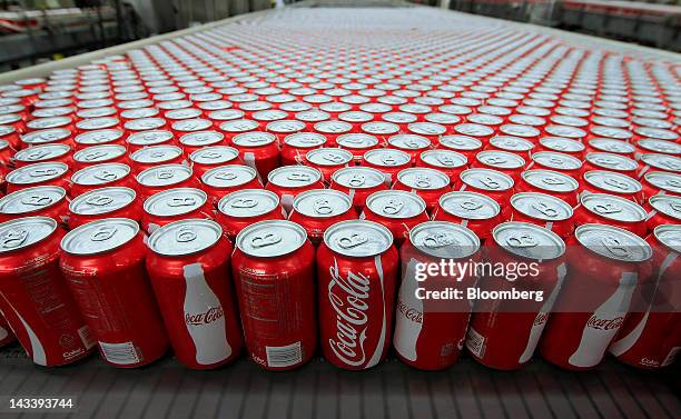 Cans of Coca-Cola Co. Soda move along a conveyor belt at the company's Swire bottling plant in Salt Lake City, Utah, U.S., on Tuesday, April 24,...