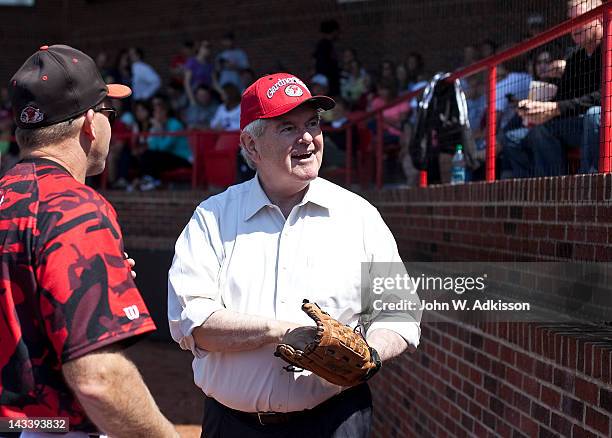 Republican presidential candidate, former Speaker of the House Newt Gingrich talk to the crowd prior to throwing out the first pitch at a baseball...