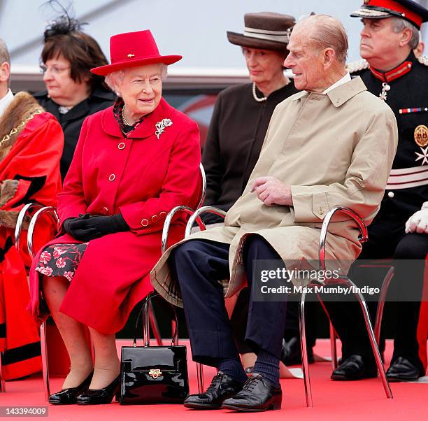 Queen Elizabeth II and Prince Philip, Duke of Edinburgh attend the opening of the restored 'Cutty Sark' Tea Clipper during a visit to Greenwich on...