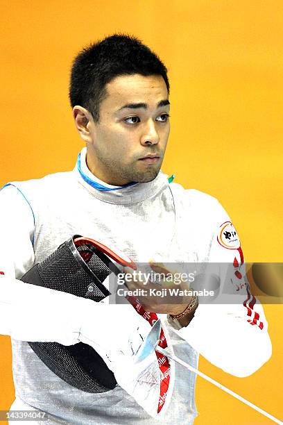 Daiki Fujino of Japan looks on in the Men's Foil Team Tableau of 4 on day four of the 2012 Asian Fencing Championships at Wakayama Big Wave on April...