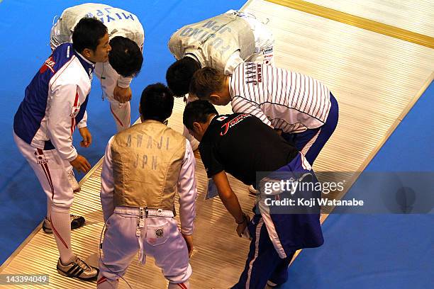 Japan team celebrates the win after in the Men's Foil Team Tableau of 8 on day four of the 2012 Asian Fencing Championships at Wakayama Big Wave on...