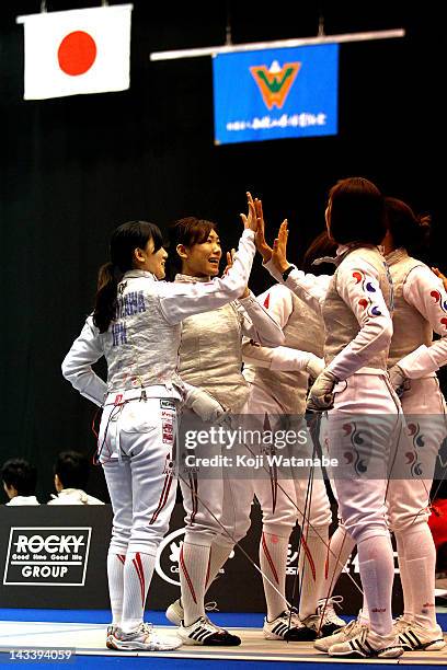 Chie Yoshizawa and Kyomi Hirata of Japan start of in the Women's Foil Team Tableau of final on day four of the 2012 Asian Fencing Championships at...