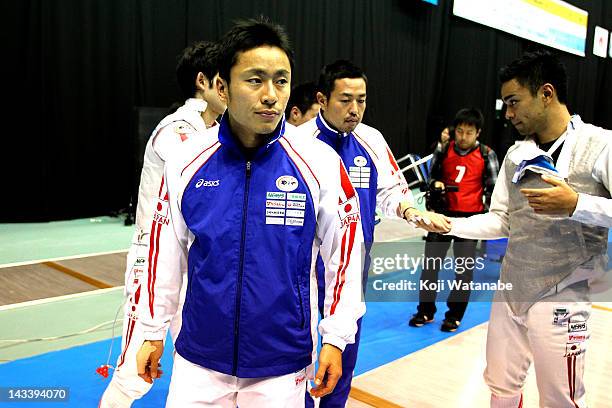 Yuki Ota of Japan celebrates the win after in the Men's Foil Team Tableau of 3rd place on day four of the 2012 Asian Fencing Championships at...