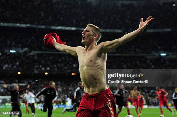 Bastian Schweinsteiger of Bayern Munich celebrates scoring the winning penalty during the UEFA Champions League Semi Final second leg between Real...