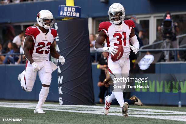 Chris Banjo of the Arizona Cardinals celebrates a fumble recovery for a touchdown against the Seattle Seahawks during the third quarter at Lumen...