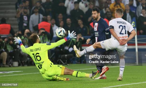 Lionel Messi of Paris Saint-Germain in action over Pau Lopez ##16 of Marseille during the Ligue 1 match between Paris Saint-Germain and Olympique...