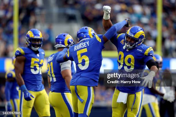 Jalen Ramsey of the Los Angeles Rams and Aaron Donald of the Los Angeles Rams celebrate after a sack during the fourth quarter against the Carolina...