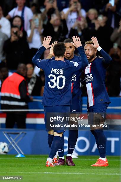 Neymar Jr of Paris Saint-Germain is congratulated by Kylian Mbappe and Leo Messi after scoring during the Ligue 1 match between Paris Saint-Germain...