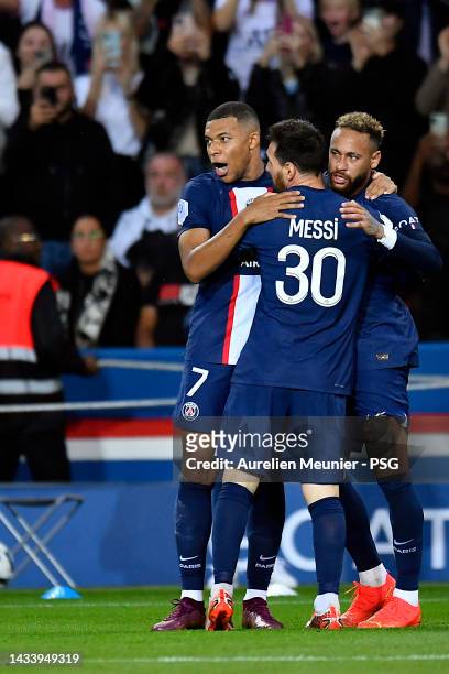 Neymar Jr of Paris Saint-Germain is congratulated by Kylian Mbappe and Leo Messi after scoring during the Ligue 1 match between Paris Saint-Germain...