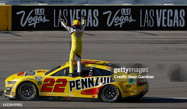 Joey Logano, driver of the Shell Pennzoil Ford, celebrates after winning the NASCAR Cup Series South Point 400 at Las Vegas Motor Speedway on October...