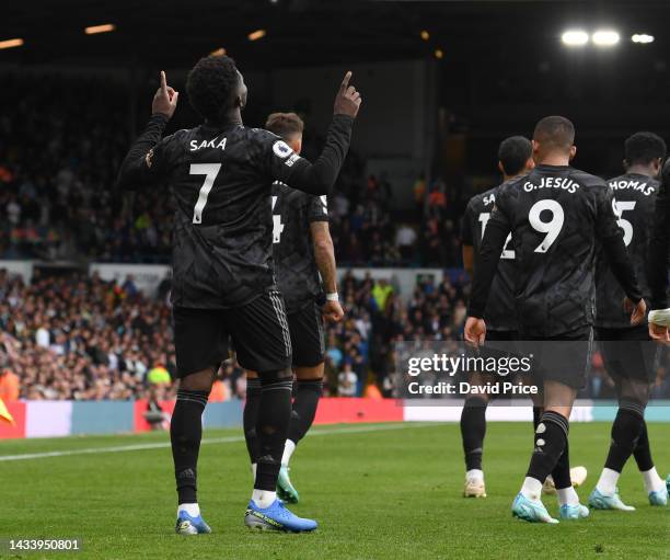 Bukayo Saka celebrates scoring Arsenal's goal during the Premier League match between Leeds United and Arsenal FC at Elland Road on October 16, 2022...