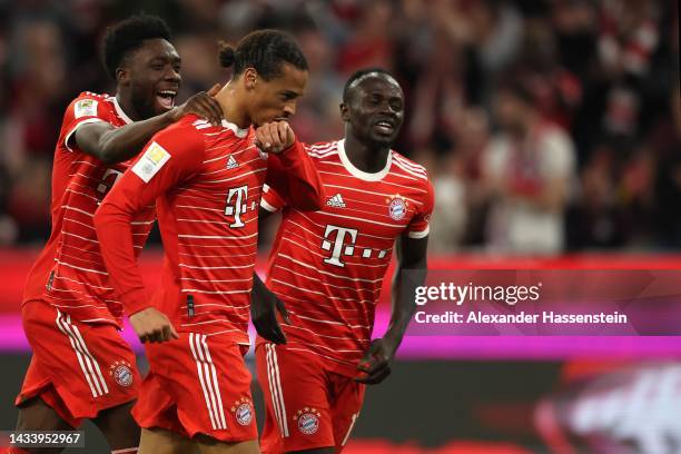 Leroy Sane of FC Bayern München celebrates scoring the 3rd team goal with his teammates Alphonos Davies and Sadio Mane during the Bundesliga match...