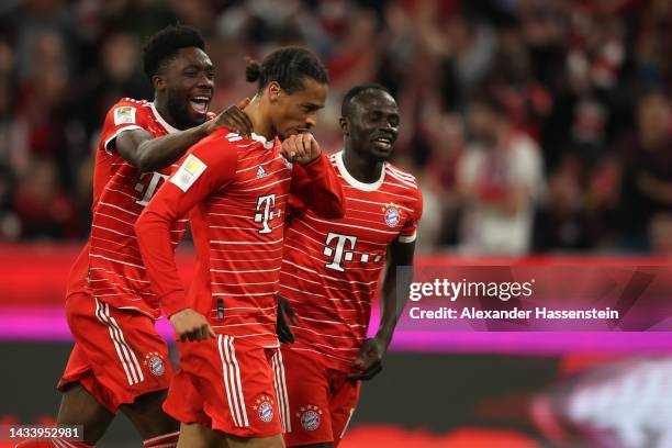 Leroy Sane of FC Bayern München celebrates scoring the 3rd team goal with his teammates Alphonos Davies and Sadio Mane during the Bundesliga match...