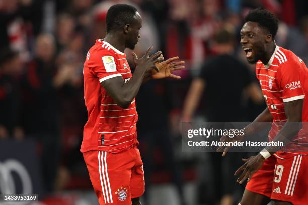 Dadio Mane of FC Bayern München celebrates scoring the 4th team goal with his teammate Alphonso Davies during the Bundesliga match between FC Bayern...