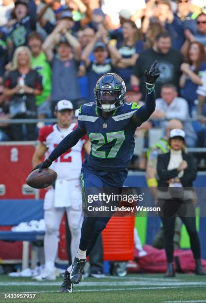Tariq Woolen of the Seattle Seahawks celebrates an interception against the Arizona Cardinals during the fourth quarter at Lumen Field on October 16,...
