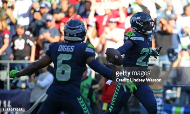 Tariq Woolen of the Seattle Seahawks celebrates an interception against the Arizona Cardinals during the fourth quarter at Lumen Field on October 16,...