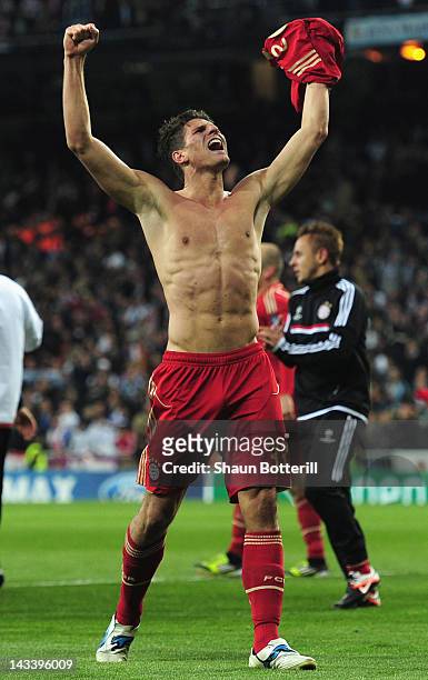 Mario Gomez of Bayern Munich celebrates with fans after scoring the winning penalty during the UEFA Champions League second leg semi-final match...