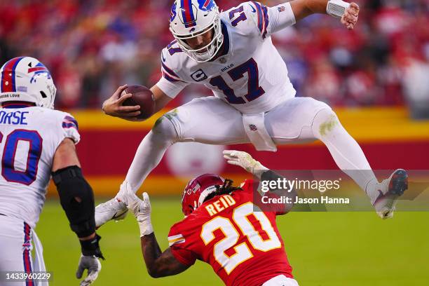 Josh Allen of the Buffalo Bills hurdles over Justin Reid of the Kansas City Chiefs during the fourth quarter at Arrowhead Stadium on October 16, 2022...