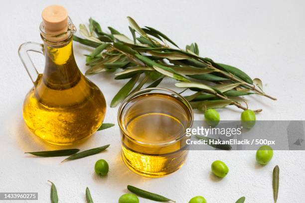 image of raw olives and olive oil - olive oil stock pictures, royalty-free photos & images
