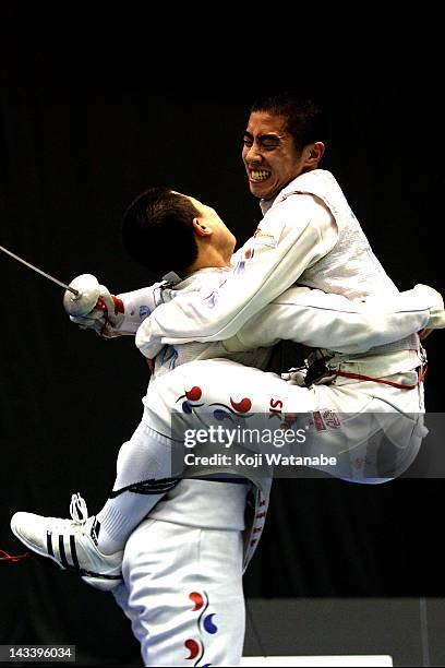 Heo Jun of South Korea celebrates the win after in the Men's Foil Team Tableau final on day four of the 2012 Asian Fencing Championships at Wakayama...