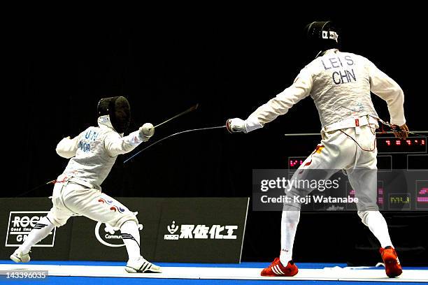 Heo Jun of South Korea competes againsti Lei Sheng of China in the Men's Foil Team Tableau final on day four of the 2012 Asian Fencing Championships...