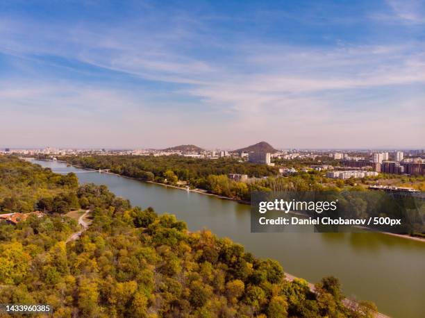 high angle view of river amidst buildings against sky,plovdiv,bulgaria - plovdiv stock pictures, royalty-free photos & images