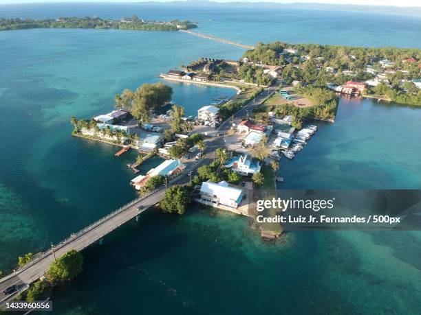 high angle view of sea and buildings against sky,koror,palau - micronesia stock pictures, royalty-free photos & images