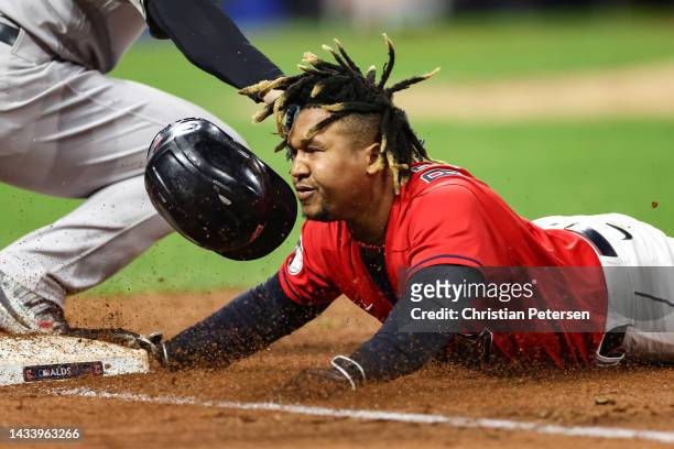 Jose Ramirez of the Cleveland Guardians is tagged out at first base by Anthony Rizzo of the New York Yankees during the third inning in game four of...