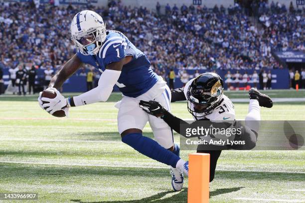 Parris Campbell of the Indianapolis Colts dives for a touchdown against Darious Williams of the Jacksonville Jaguars during the second quarter at...