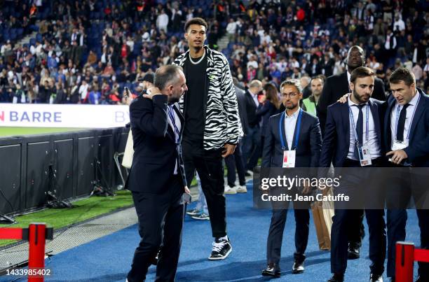 French basketball player Victor Wembanyama and his agent Jeremy Medjana attend the Ligue 1 match between Paris Saint-Germain and Olympique de...