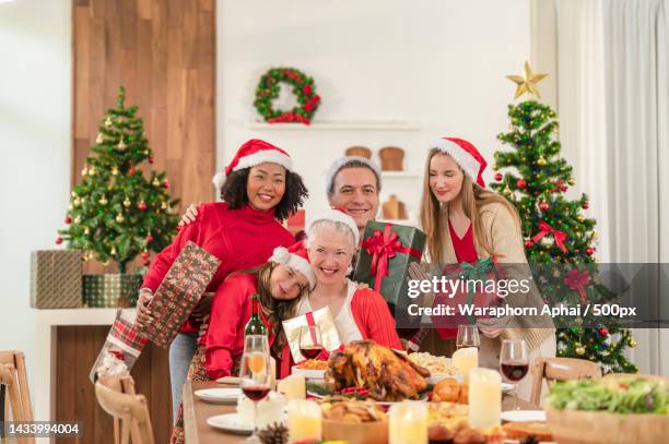 happy holidays and a merry christmas
a joyful family having fun and playing together at home,bangkok,thailand - happy holidays family stock pictures, royalty-free photos & images