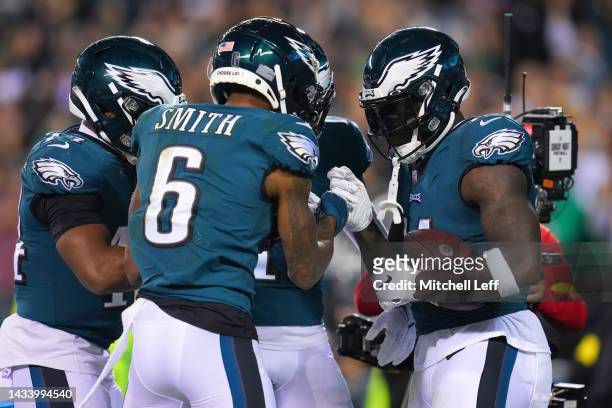 Brown celebrates with DeVonta Smith of the Philadelphia Eagles after scoring a touchdown in the second quarter of the game against the Dallas Cowboys...