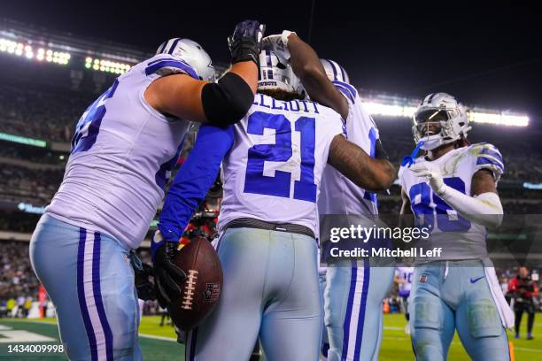 Ezekiel Elliott of the Dallas Cowboys celebrates with teammates after a rushing touchdown in the third quarter of the game against the Philadelphia...