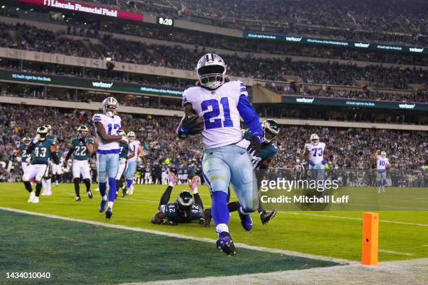 Ezekiel Elliott of the Dallas Cowboys runs into the end zone for a rushing touchdown in the third quarter of the game against the Dallas Cowboys at...