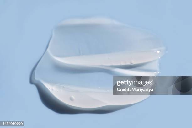 texture of white cream on a blue background. - jojoba stock pictures, royalty-free photos & images
