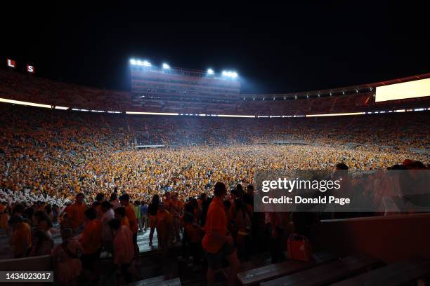 Tennessee Volunteers fans rush the field after defeating the Alabama Crimson Tide at Neyland Stadium on October 15, 2022 in Knoxville, Tennessee....