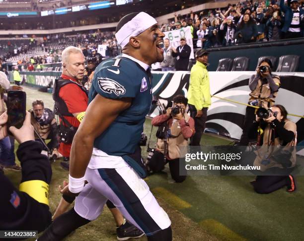 Jalen Hurts of the Philadelphia Eagles celebrates as he runs off the field after defeating the Dallas Cowboys 26-17 at Lincoln Financial Field on...