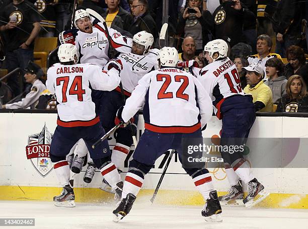 Joel Ward of the Washington Capitals is congratulated after he scored the game winning goal against the Boston Bruins in Game Seven of the Eastern...