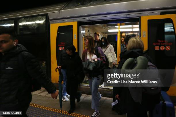 Commuters disembark a train arriving at Central railway station on October 17, 2022 in Sydney, Australia. The New South Wales Government and rail...