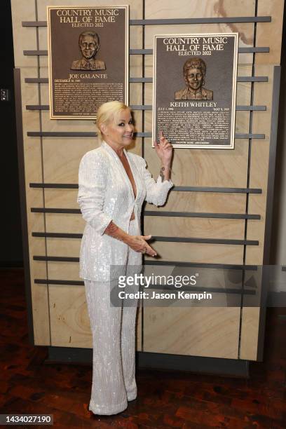 Lorrie Morgan poses with plaque honoring inductee Keith Whitley at the class of 2022 Medallion Ceremony at Country Music Hall of Fame and Museum on...