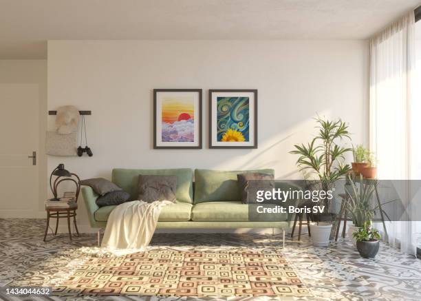 living room with artworks on the wall - indoors stock pictures, royalty-free photos & images
