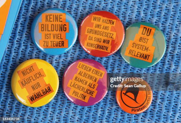 Election campaign buttons of the Piratenpartei lie on a table at an election campaign stand on April 24, 2012 in Erkelenz, Germany. The state of...