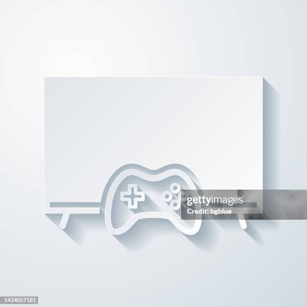 tv with gamepad. icon with paper cut effect on blank background - gaming controller white stock illustrations