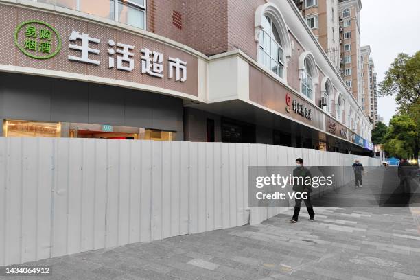 Barrier fence is erected around a community designated as medium-risk for COVID-19 on October 15, 2022 in Shanghai, China.