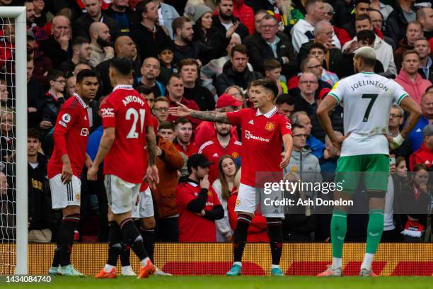 Lisandro Martinez of Manchester United gestures to Bruno Fernandes and Casemiro of Manchester United during the Premier League match between...