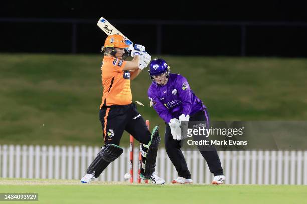 Sophie Devine of the Scorchers is bowled by Molly Strano of the Hurricanes during the Women's Big Bash League match between the Hobart Hurricanes and...