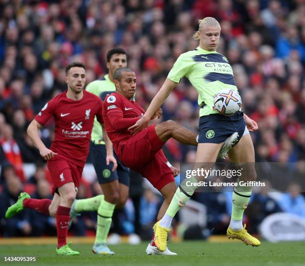 Erling Haaland of Manchester City is challenged by Thiago Alcantara of Liverpool during the Premier League match between Liverpool FC and Manchester...
