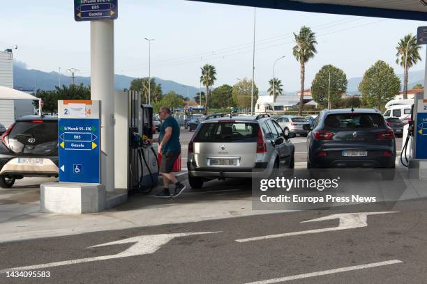 Vehicles refuel at a gas station in Le Boulou, October 17 in Le Boulou, France. The strike in France's refineries as a result of constant increases...