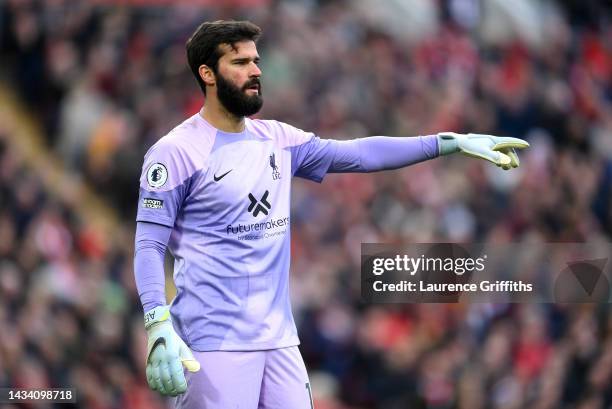 Alisson Becker of Liverpool looks on during the Premier League match between Liverpool FC and Manchester City at Anfield on October 16, 2022 in...