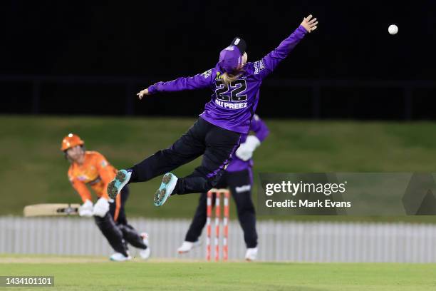 Mignon Du Preez of the Hurricanes attempts to catch a shot from Chloe Piparo of the Scorchers during the Women's Big Bash League match between the...